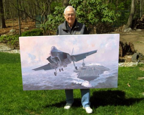 Aviation artist Keith Ferris with a giclee reproduction on canvas of his most recent commissioned oil painting of the F35